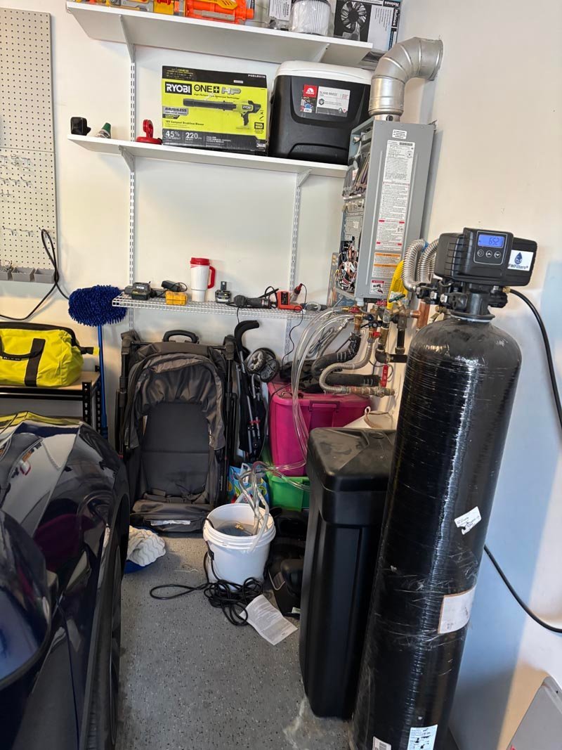 Tankless water heater descale and flush service in a Las Vegas garage